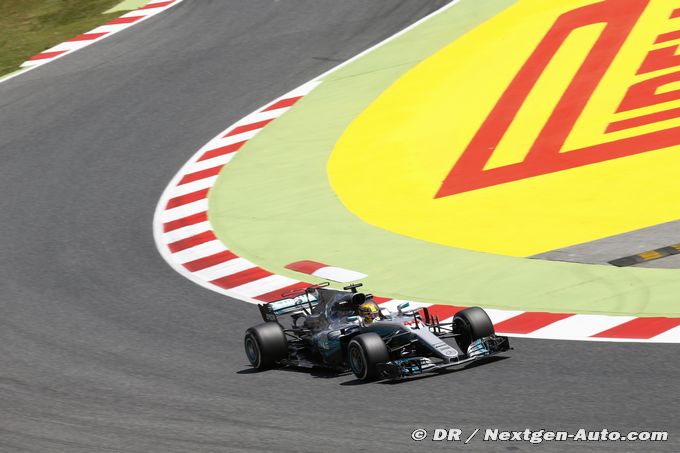 Hamilton edges Vettel to take Spanish